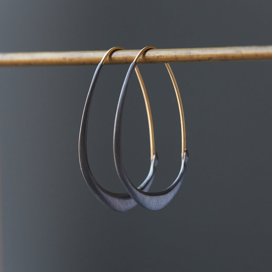 Silver and gold facet hoops by Hannah Blount