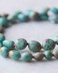 Kingman turquoise necklace with coral-hued silk and silver clasp by Hannah Blount