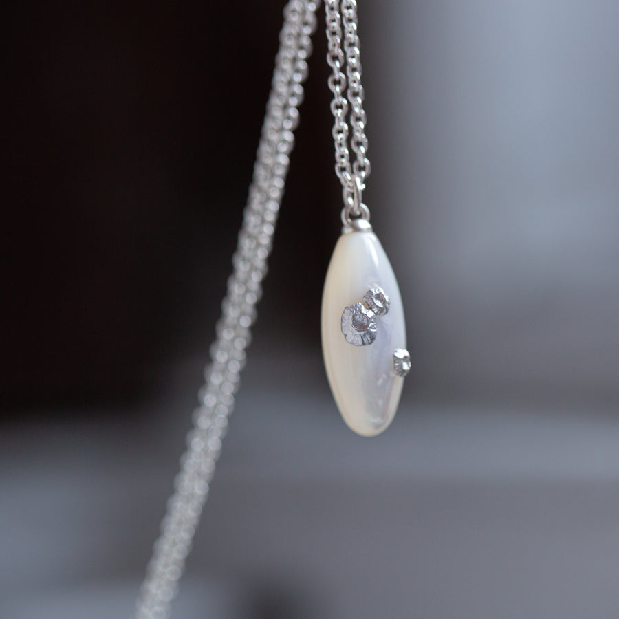 medium oval mother of pearl necklace with silver barnacles by hannah blount