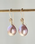 pink pearls hang from gold rose ear wires