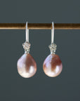 pink pearl drop earrings with bright sterling silver ear wires with rose accents.