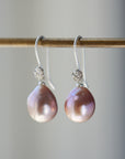 pink pearl drop earrings with bright sterling silver ear wires with rose accents.