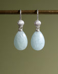 teardrops of pale, icy aquamarine hang beneath little silver scallop shell ear wires