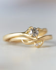 gold branch ring with little salt and pepper diamond, stacked with the little branch waiting ring with diamond. 18k yellow gold.