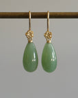 sage green nephrite jade teardrops hang beneath gold rose ear wires