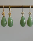 sage green nephrite jade teardrops hang beneath silver and gold rose ear wires