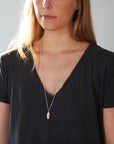 medium Mother of pearl necklace by Hannah Blount- on person