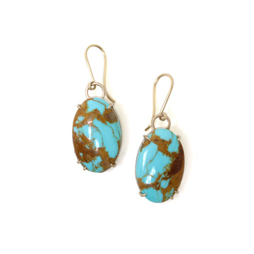 mottled kingman turquoise earrings set in gold prongs