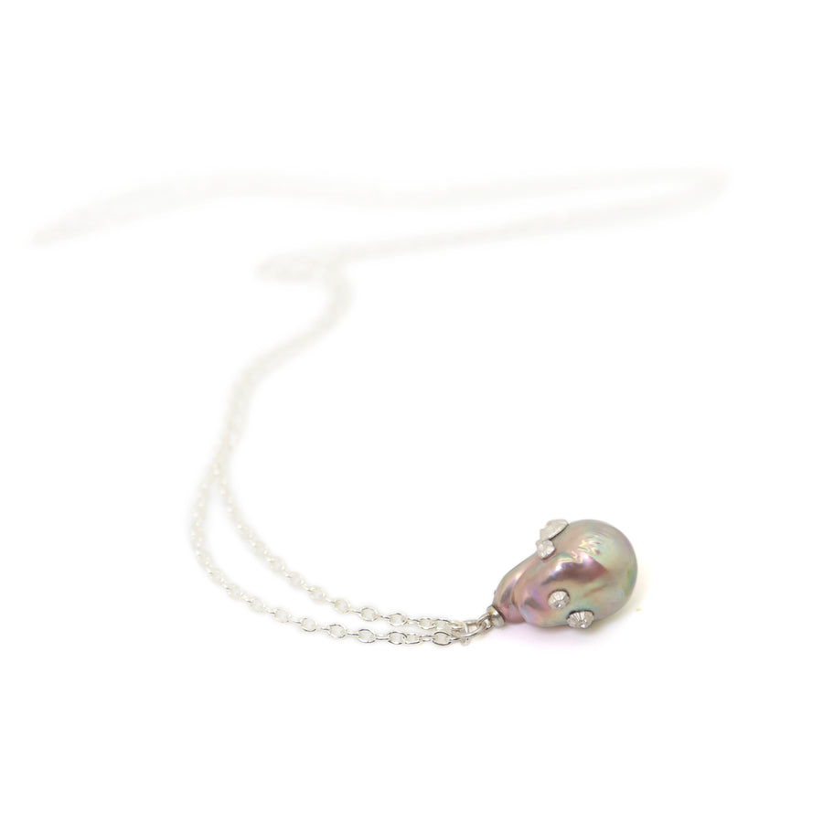 large pink baroque freshwater pearl pendant with silver barnacles on long silver chain by hannah blount jewelry