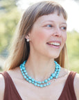 Kingman turquoise double-strand necklace with coral-hued silk and silver clasp by Hannah Blount