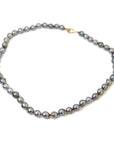 Tahitian black pearls with gold barnacles