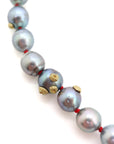 Tahitian black pearls with gold barnacles