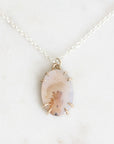 Dendritic agate necklace held in delicate gold prongs
