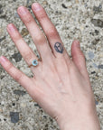 Gold aquamarine ring on hand