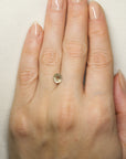1.2ct Gold Montana Sapphire on hand for scale