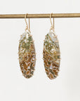 Pair of earrings with natural stone design on a white background