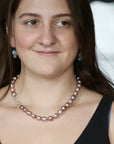 woman wearing pink pearl strand