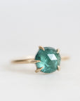 Green stone ring with prongs