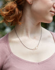 Oxidized silver + 14k gold egg necklace on person- Hannah Blount