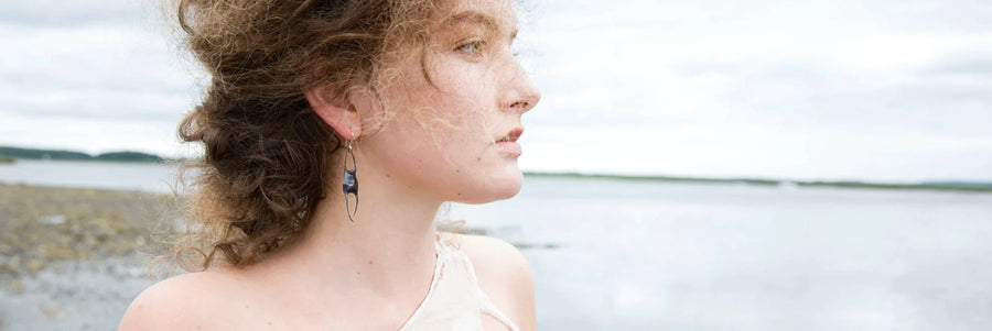 model wearing hbj skate case earrings