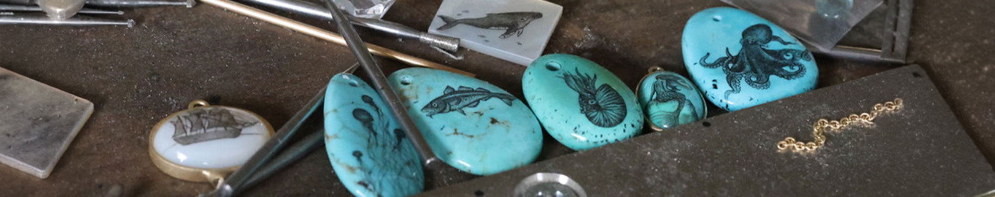 jeweller's bench with scrimshaw on turquoise pieces