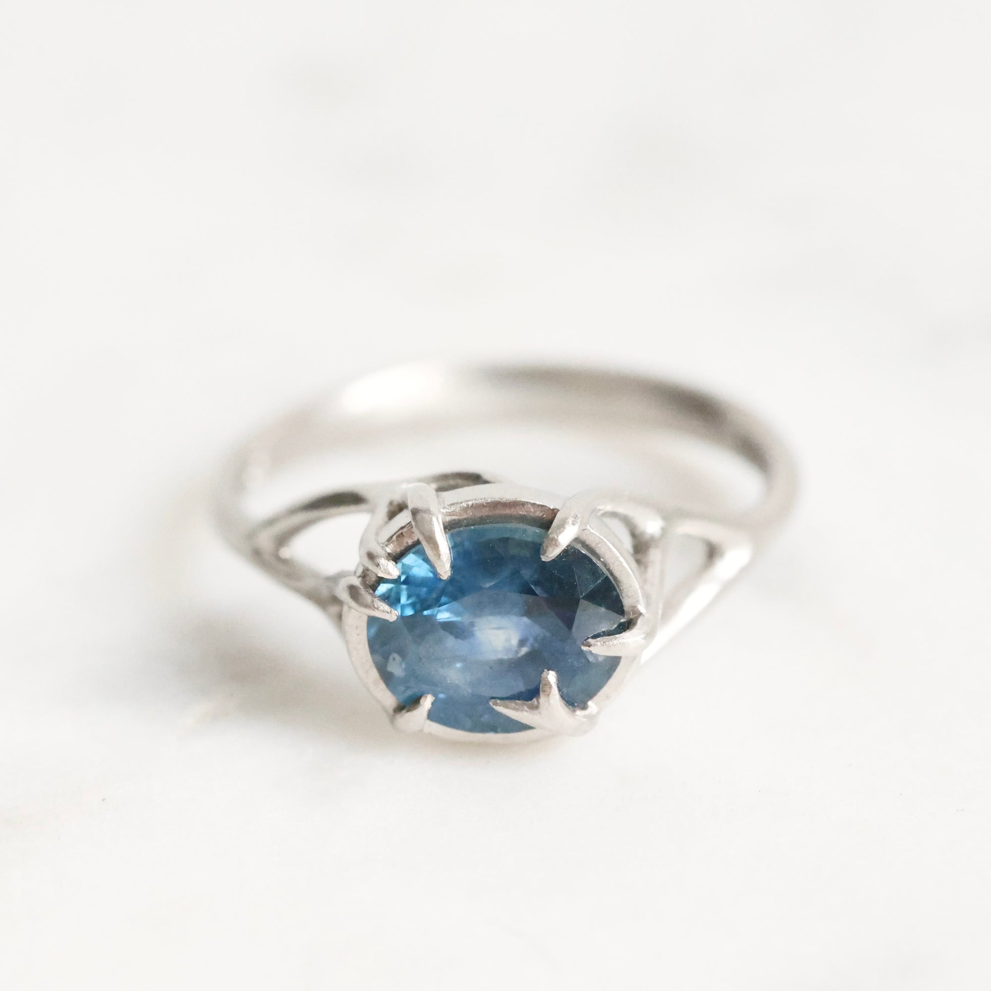 Platinum branchy ring with deep blue stone