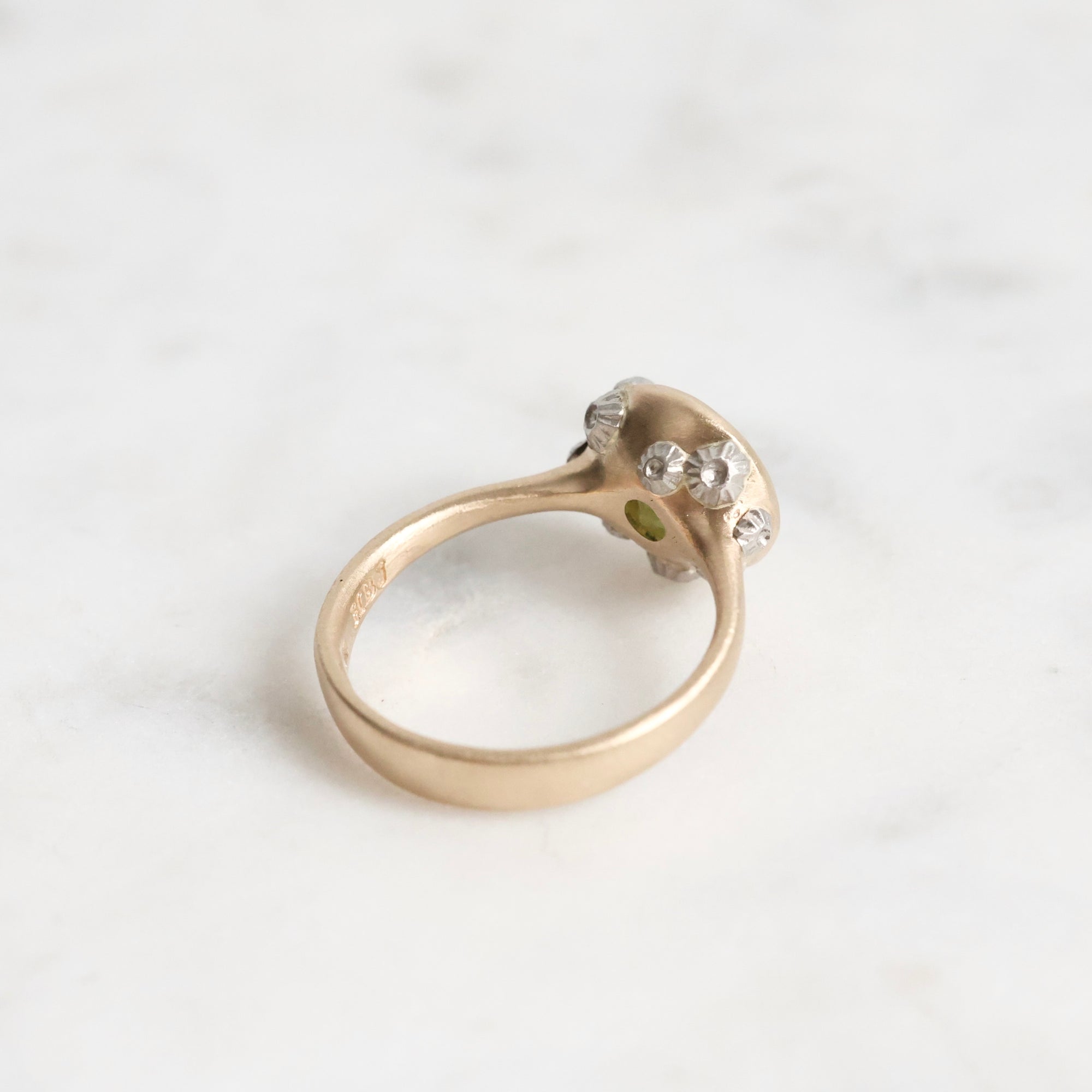 green gemstone ring with barnacles 