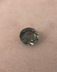 Round gemstone on a beige background