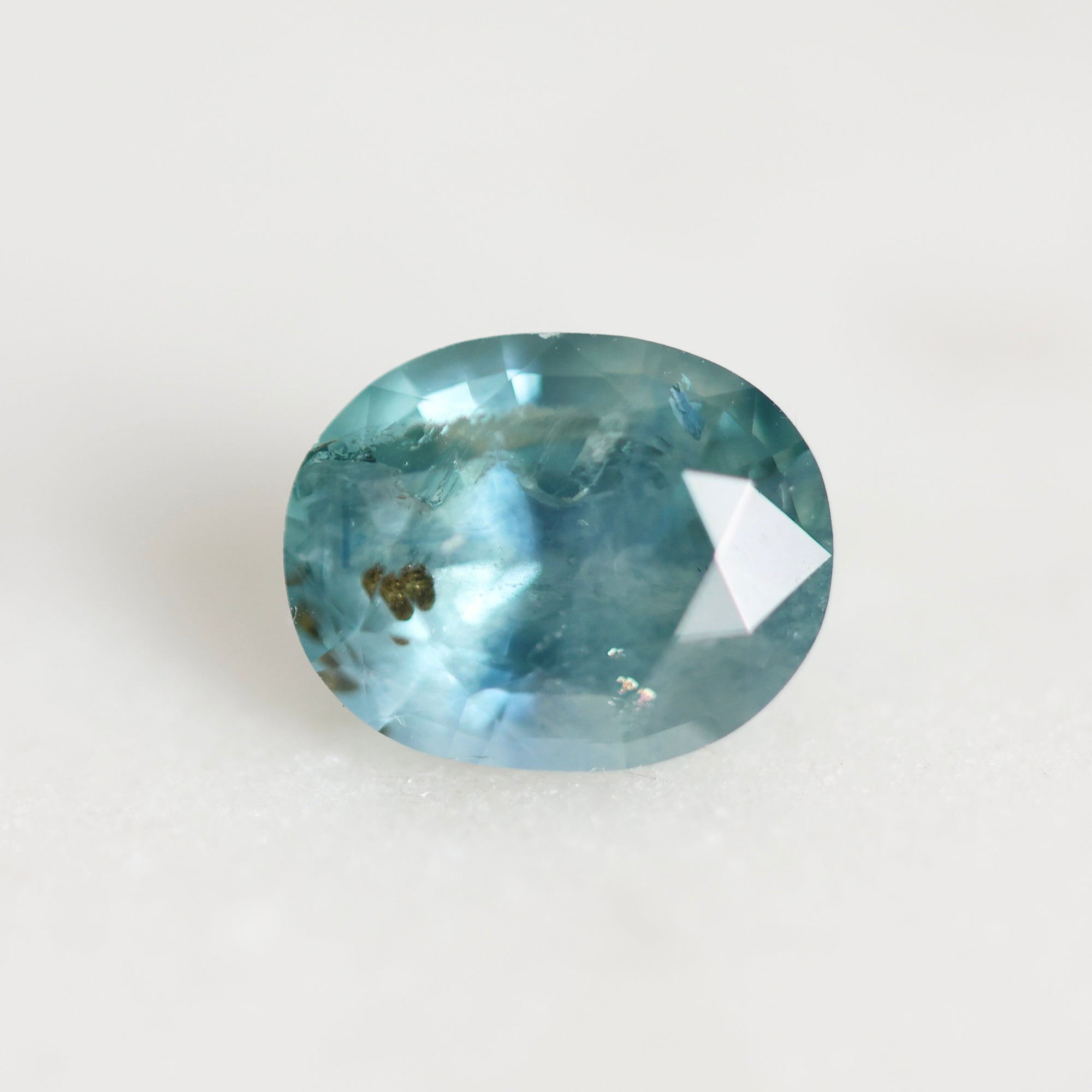 Blue sapphire with brown inclusion 