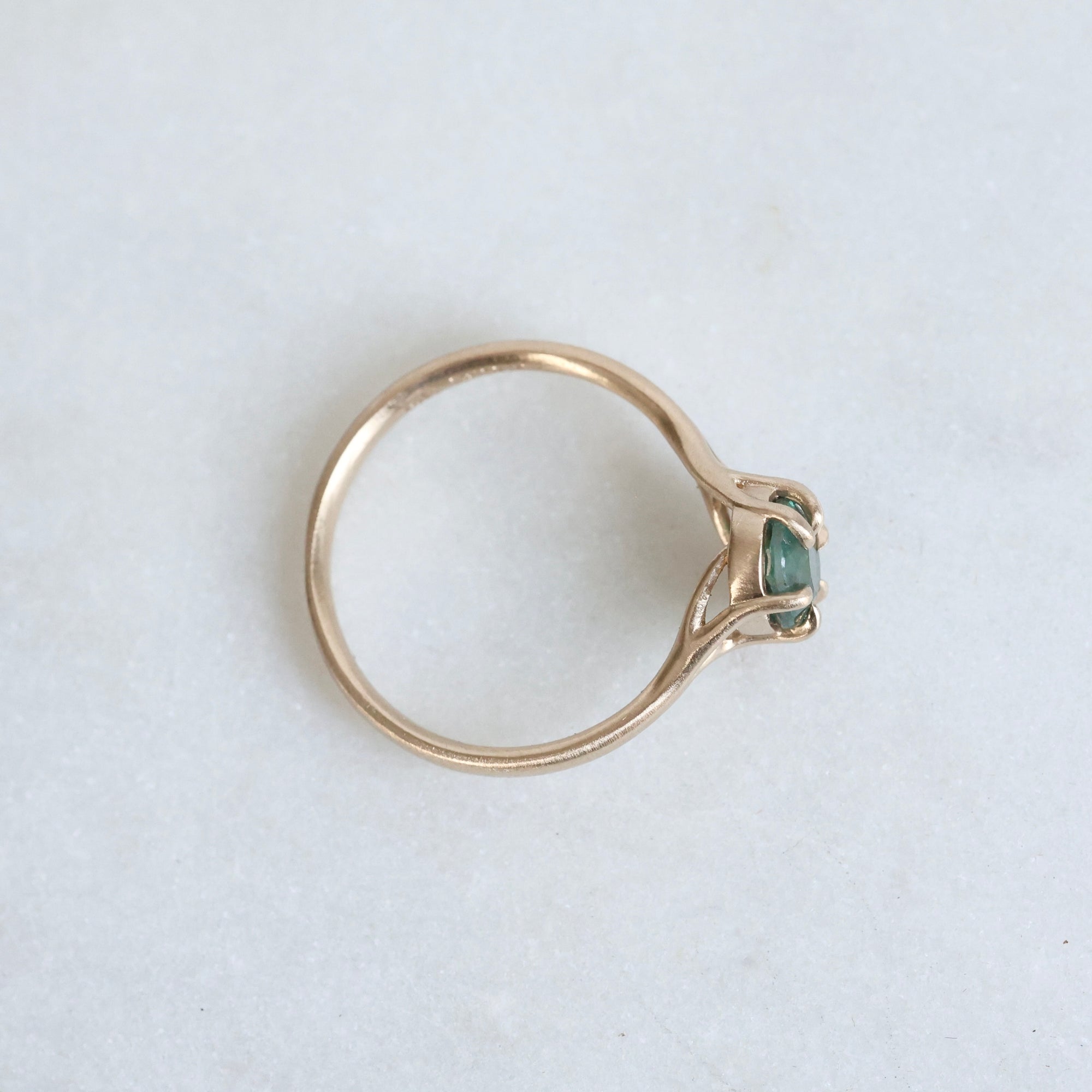 Green/blue sapphire in gold branchy setting