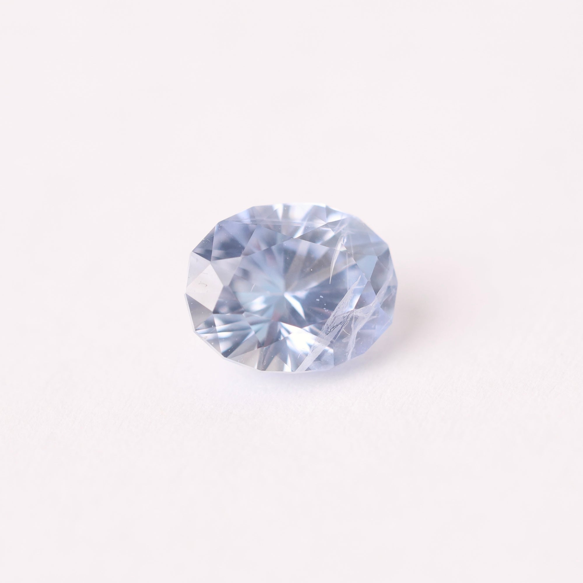 Blue gemstone on a white background