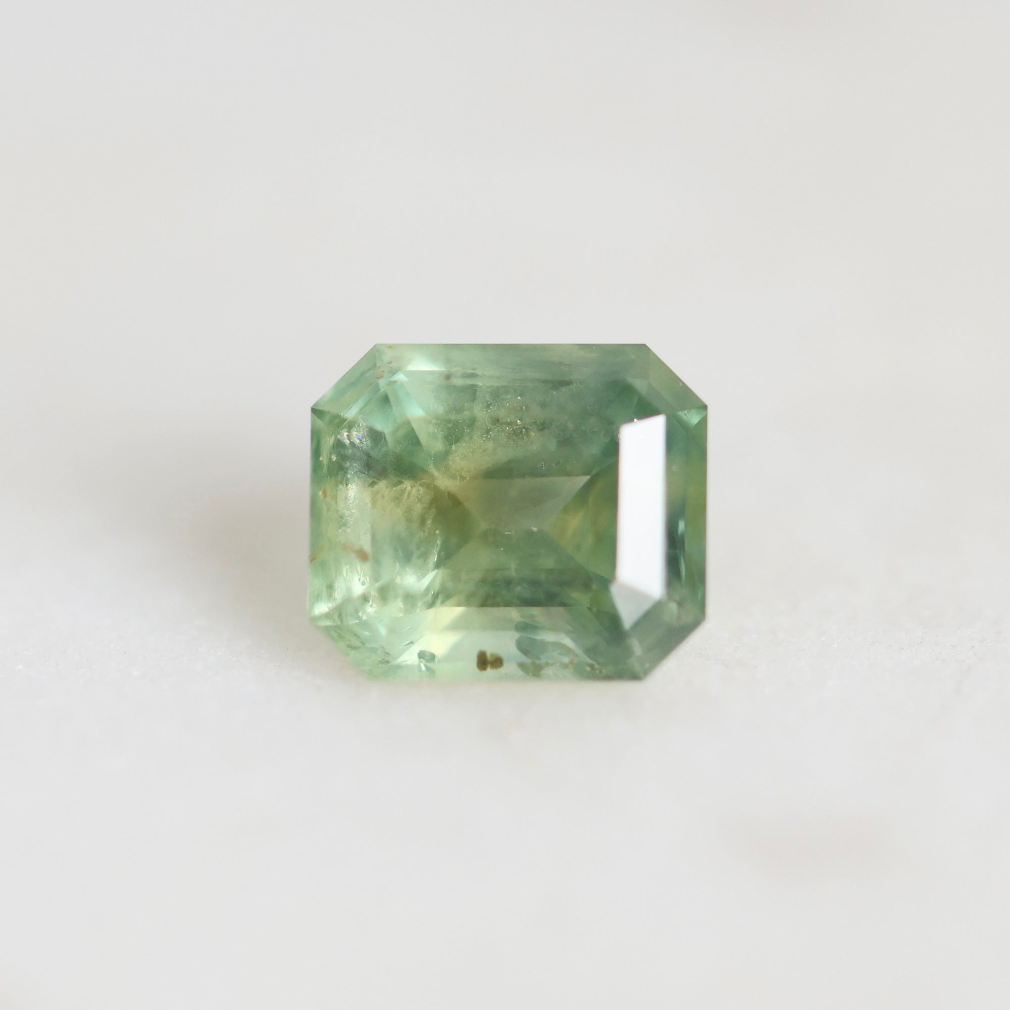 green emerald cut sapphire