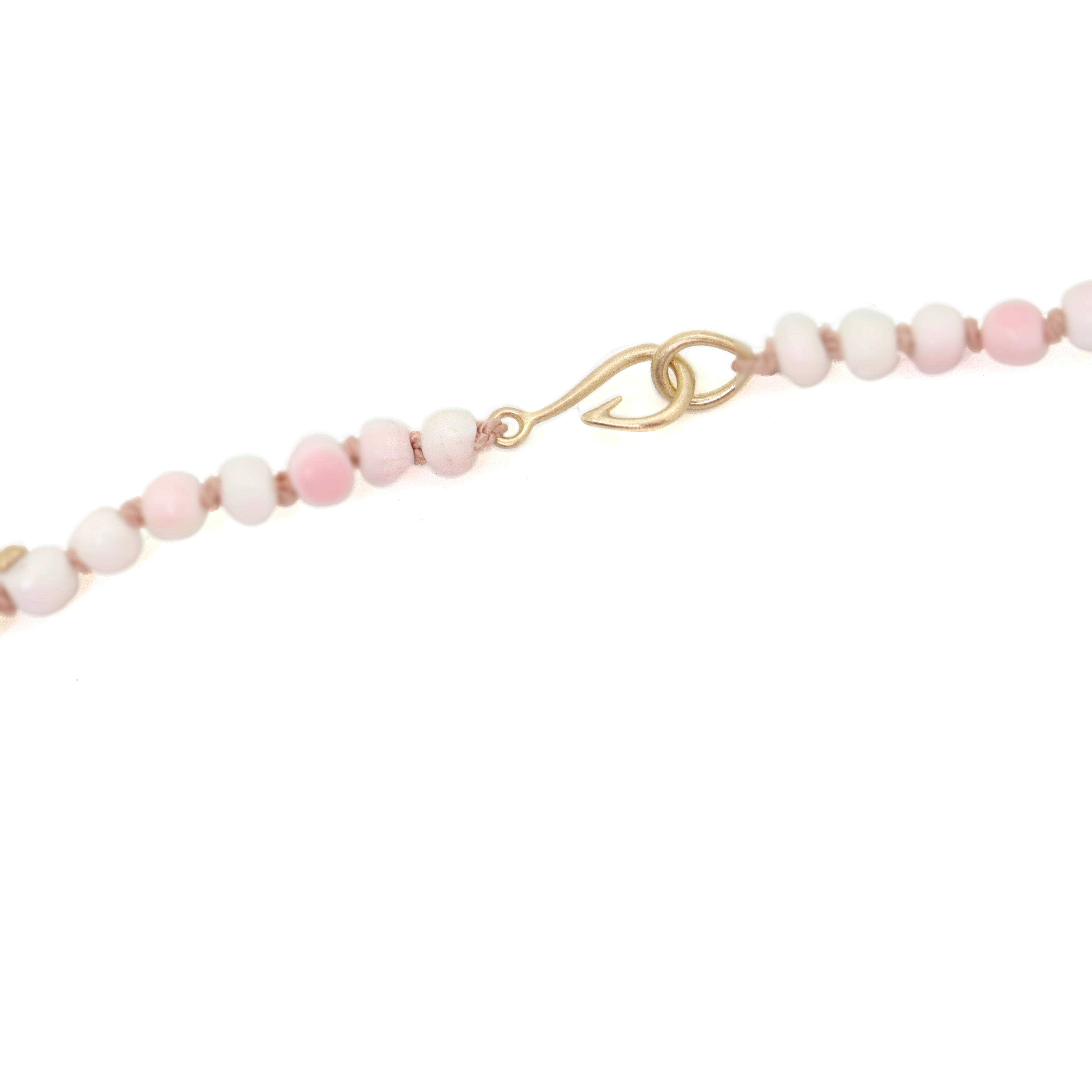 vintage angel skin coral beads are white and pink with yellow gold barnacles and pink silk