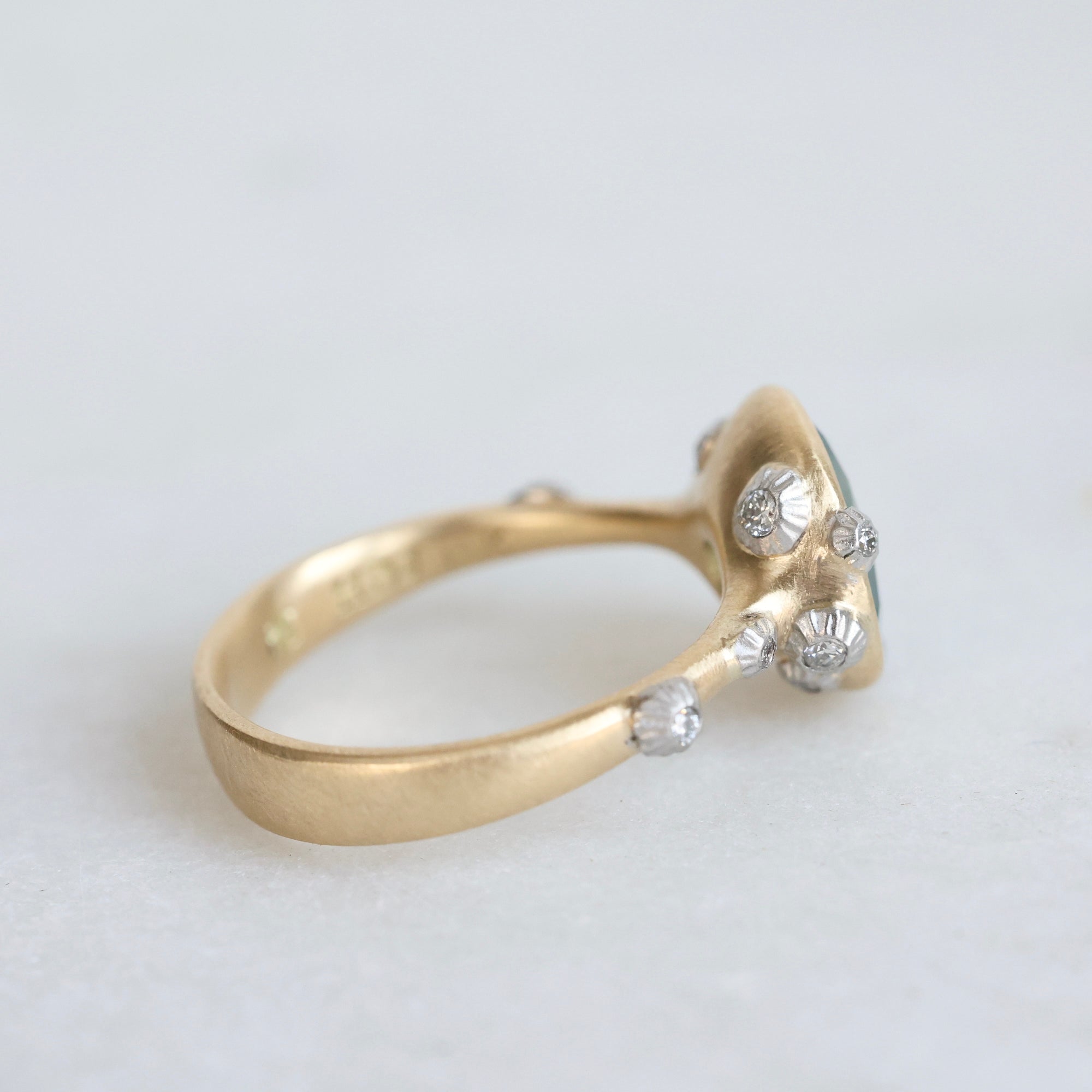 Gold ring with platinum barnacles set with diamonds from behind 