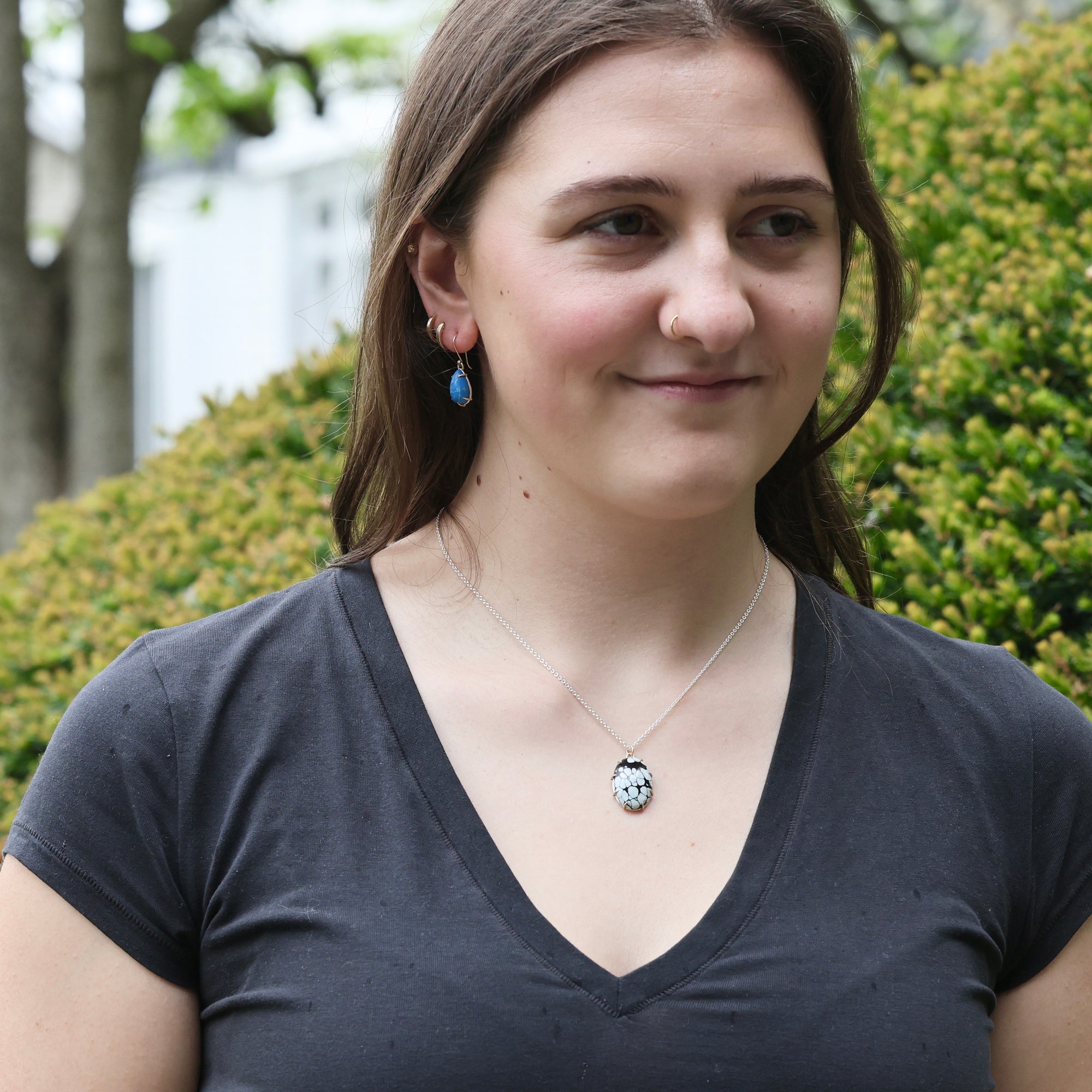 woman wearing Petrichor Variscite  necklace outside