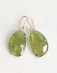 Green stone earrings on a white background