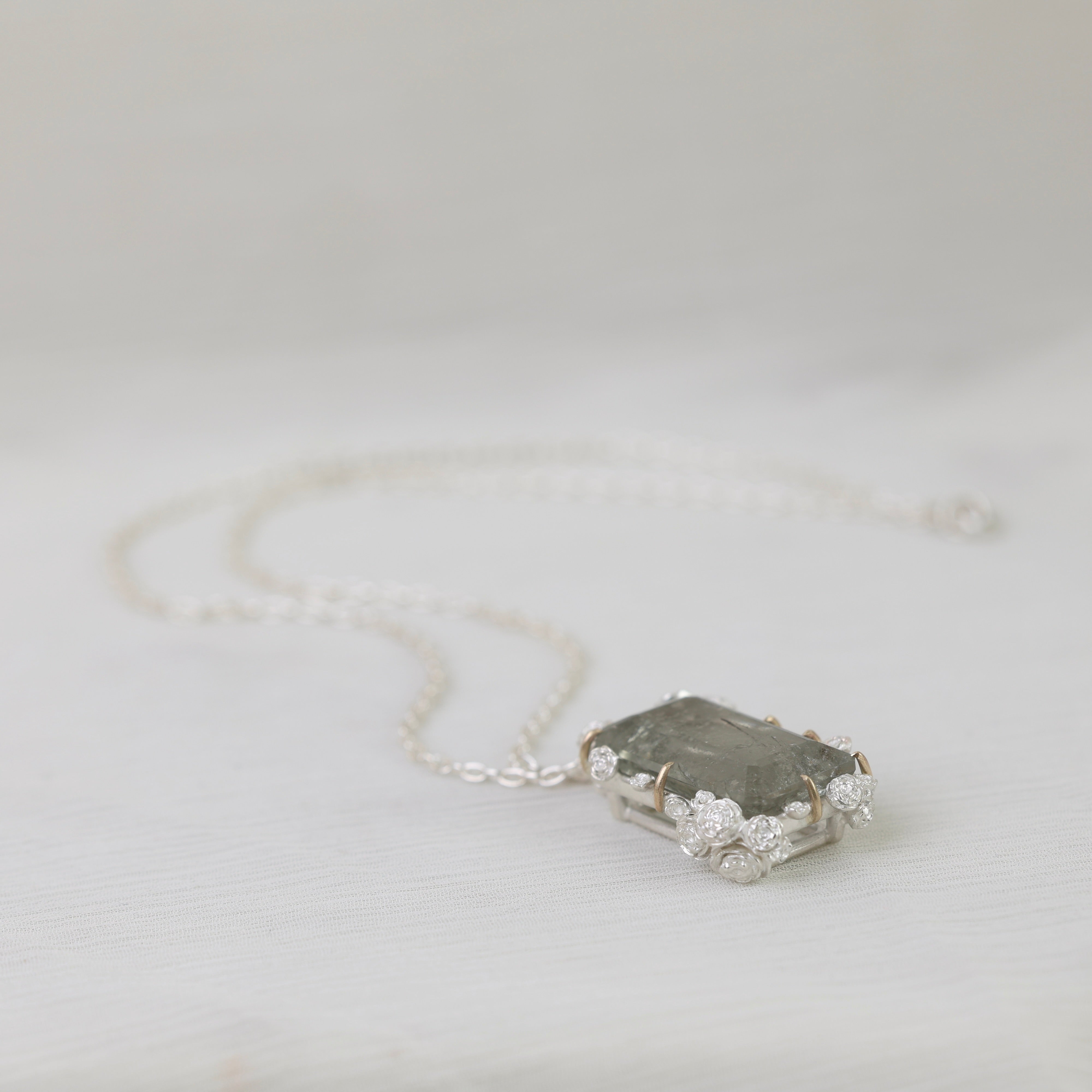 Necklace with a unique pendant on a light gray background
