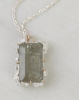 Necklace with a rectangular pendant on a light gray background