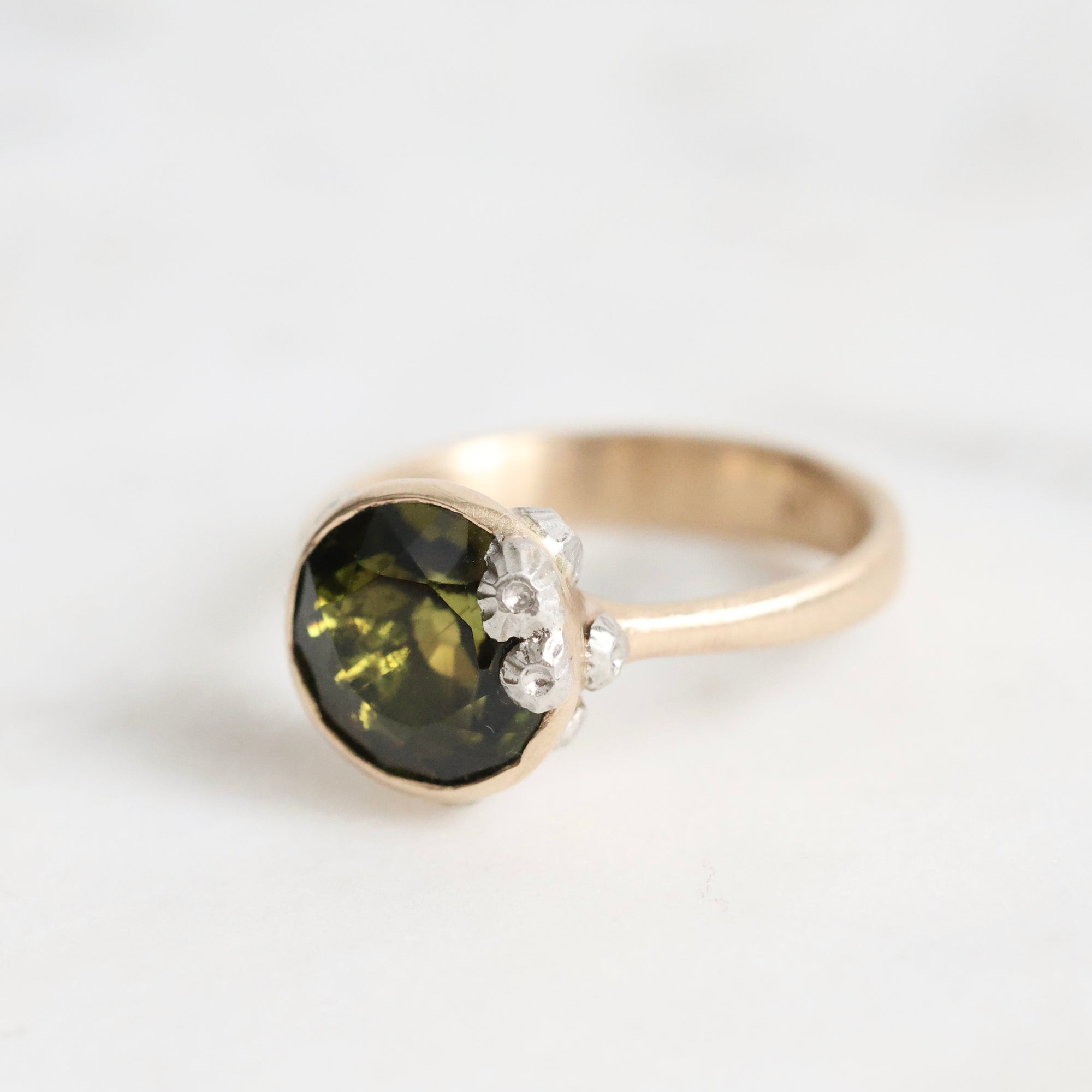 green gemstone ring with barnacles 