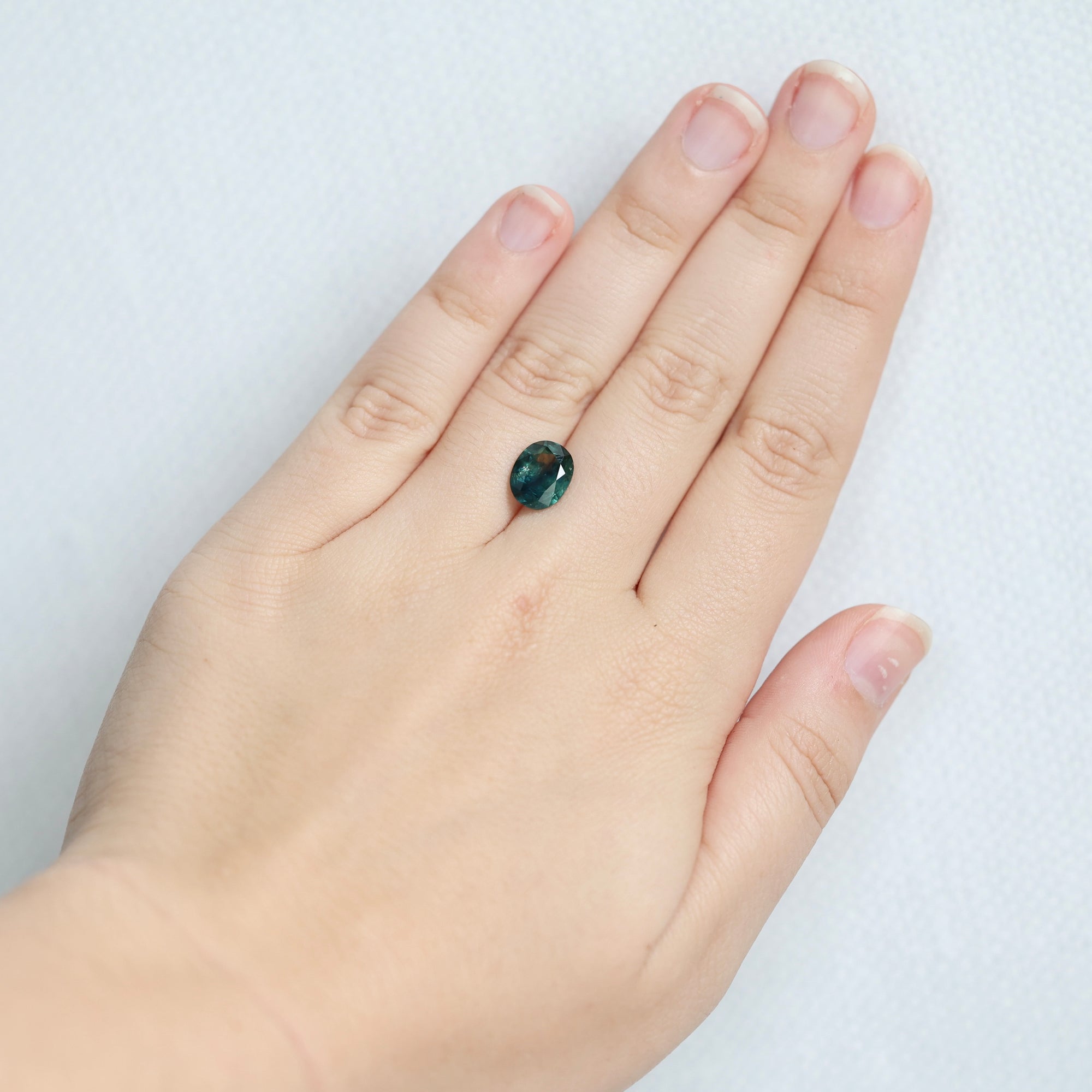 Green sapphire on hand 