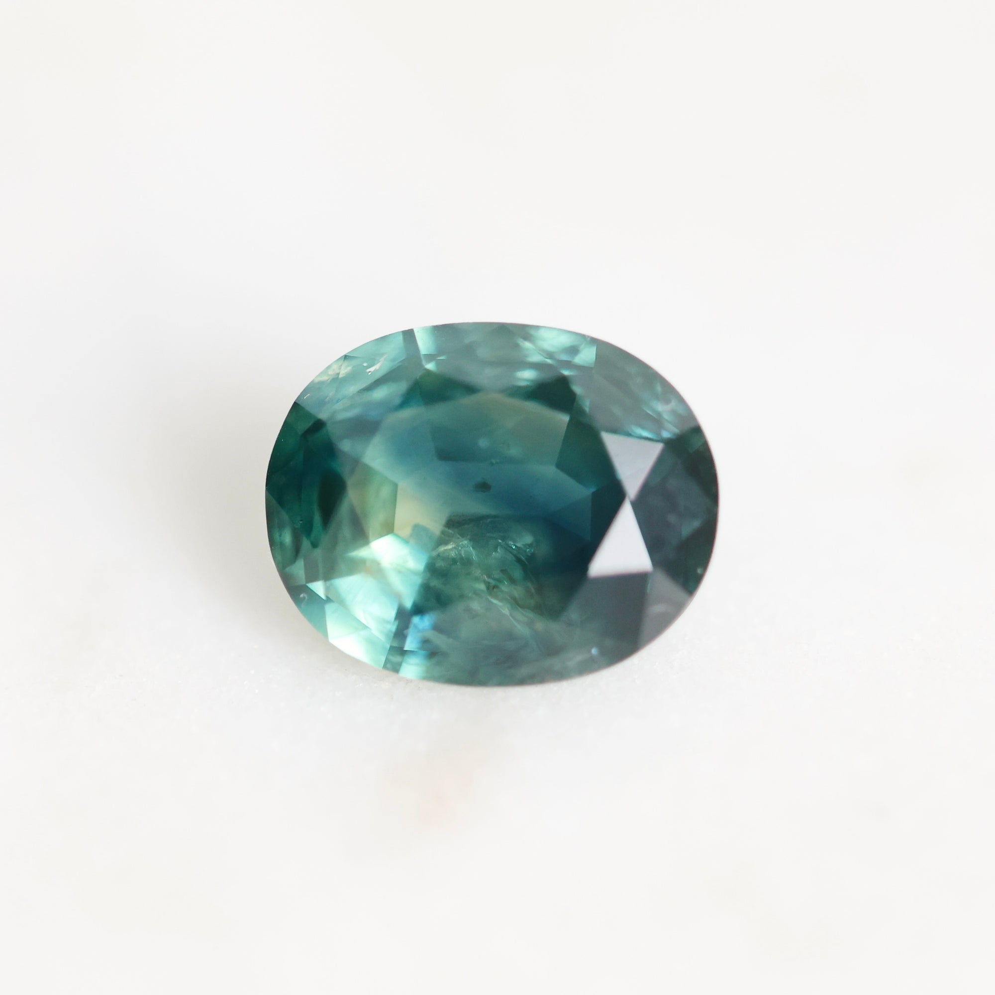 Green montana sapphire with inclusions