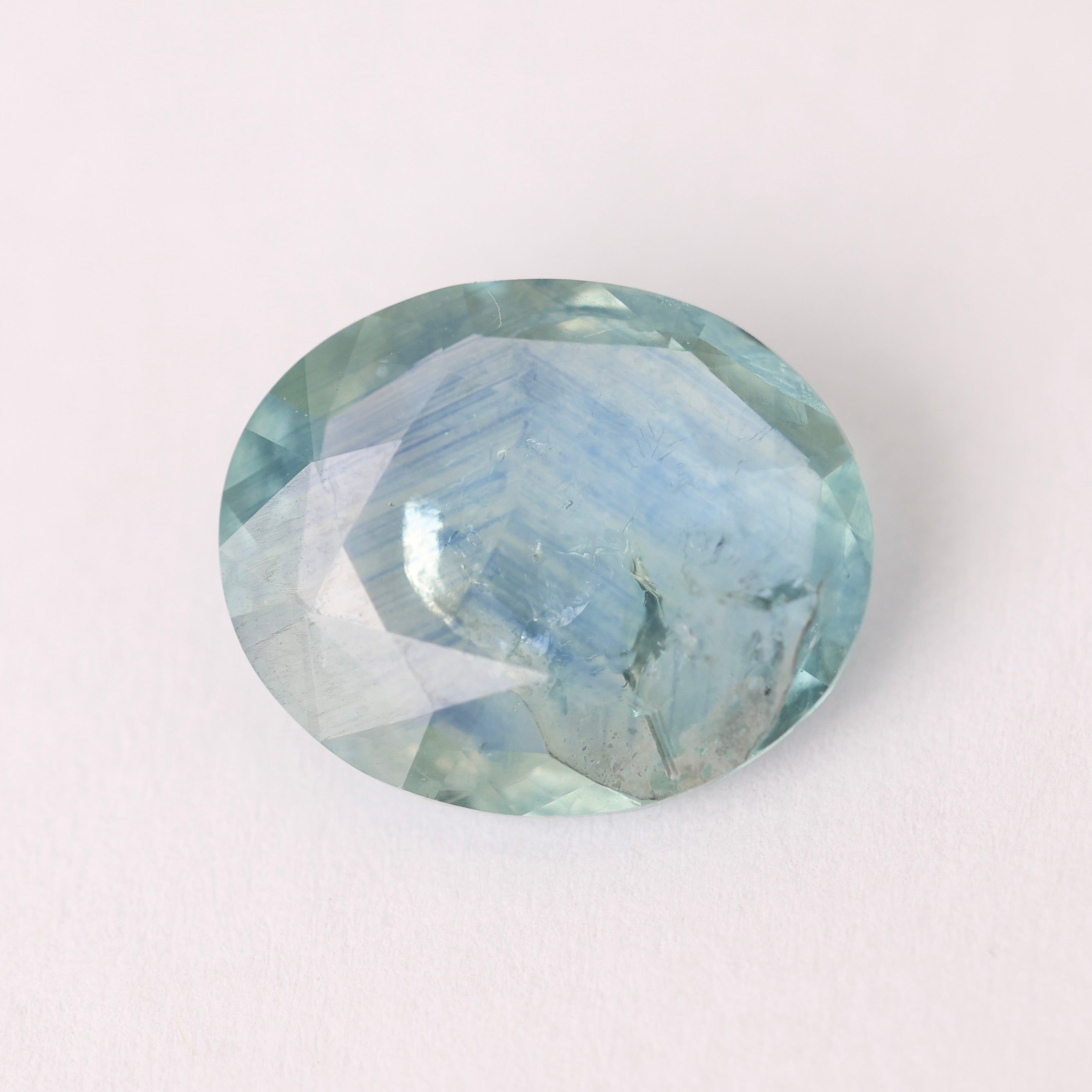 Faceted gemstone on a white