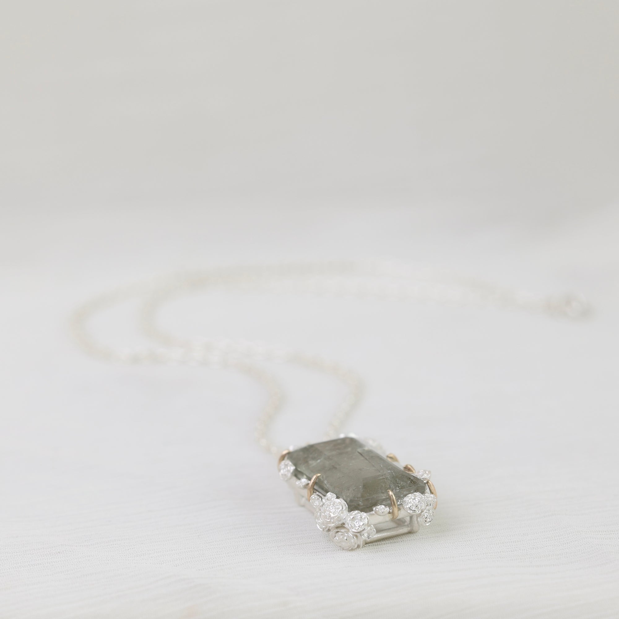 Necklace with a pendant on a light gray background