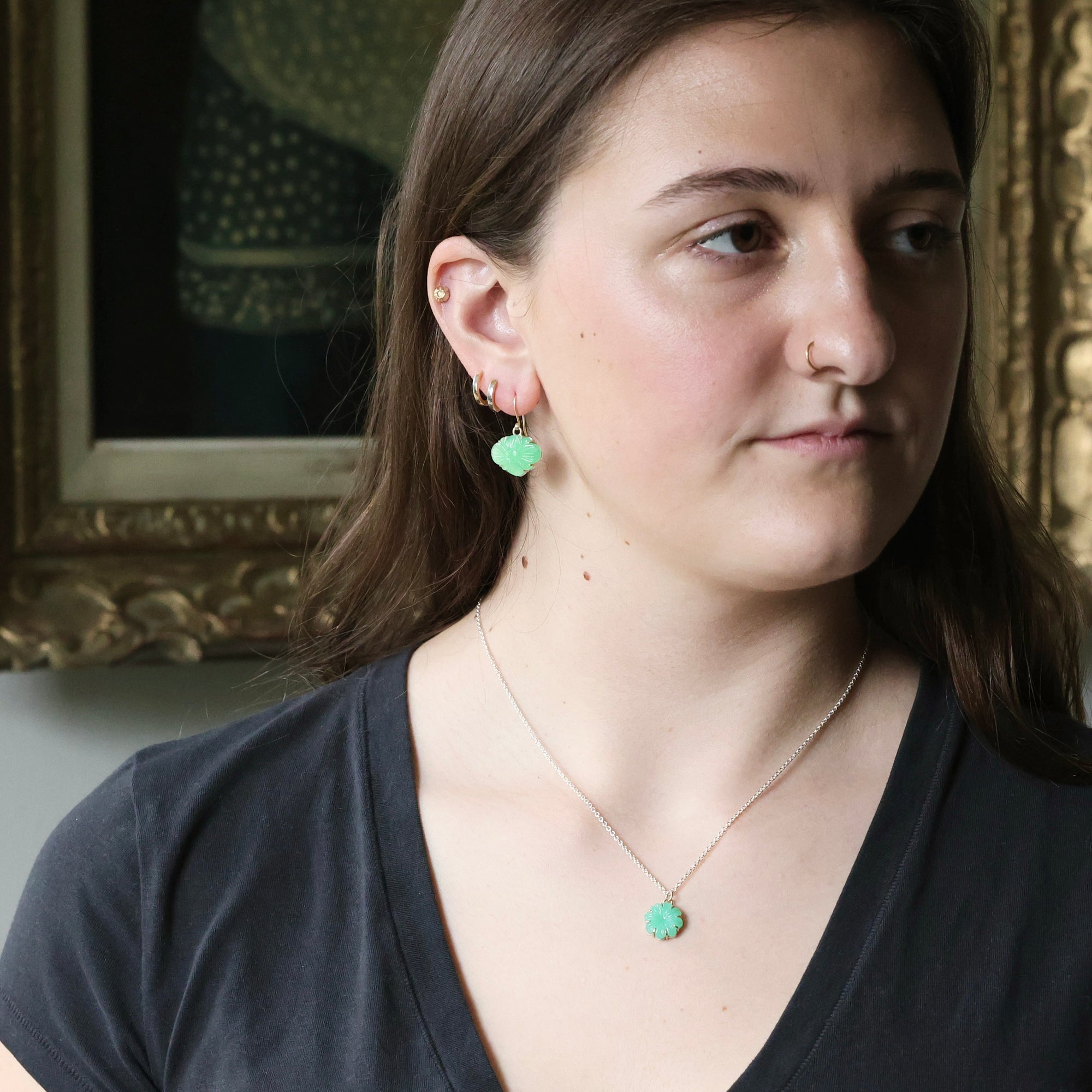 Woman wearing green earrings 