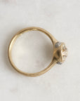 Gold ring with diamond and platinum barnacles on a white background 
