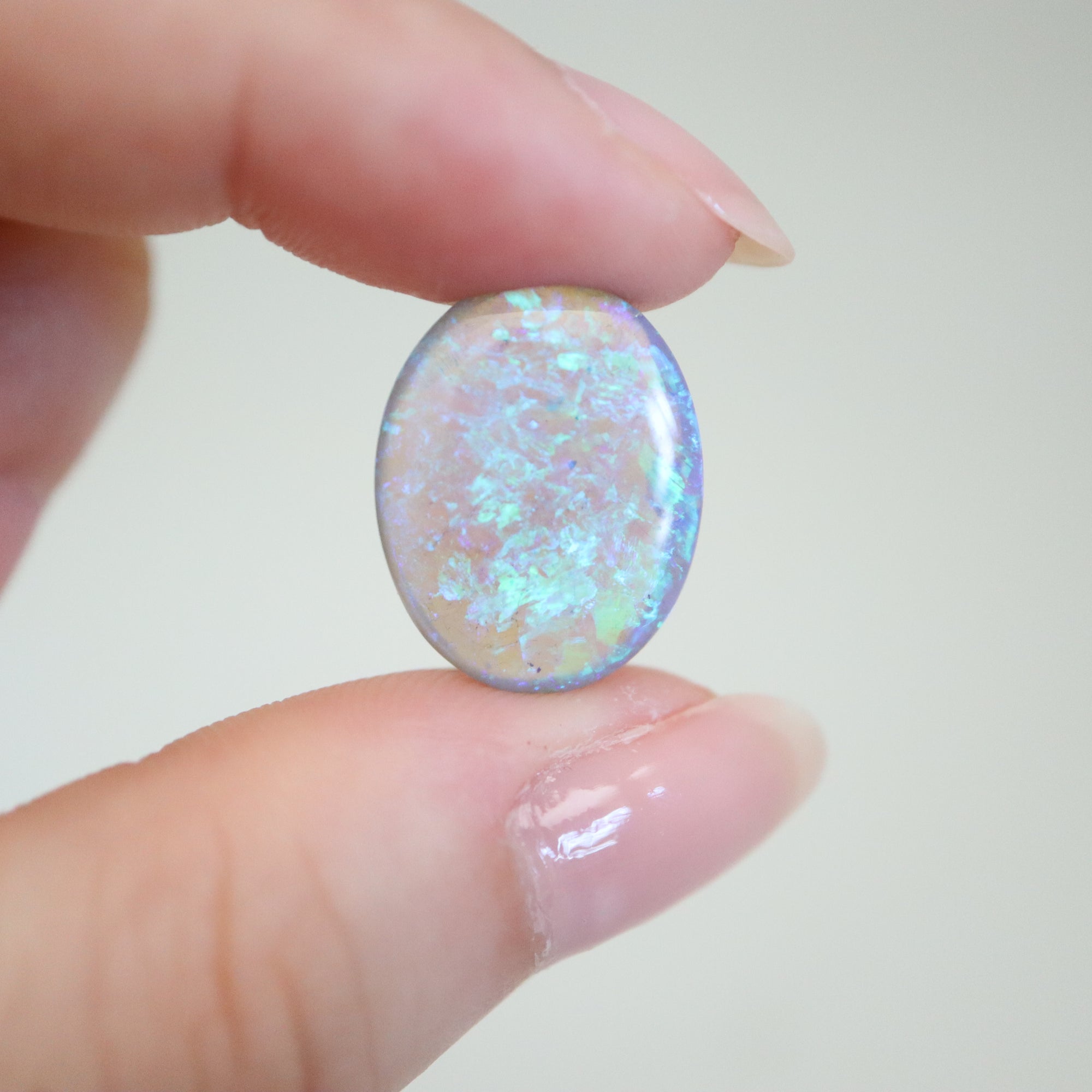 7.2ct Lightning Ridge Australian Opal in hand for scale.