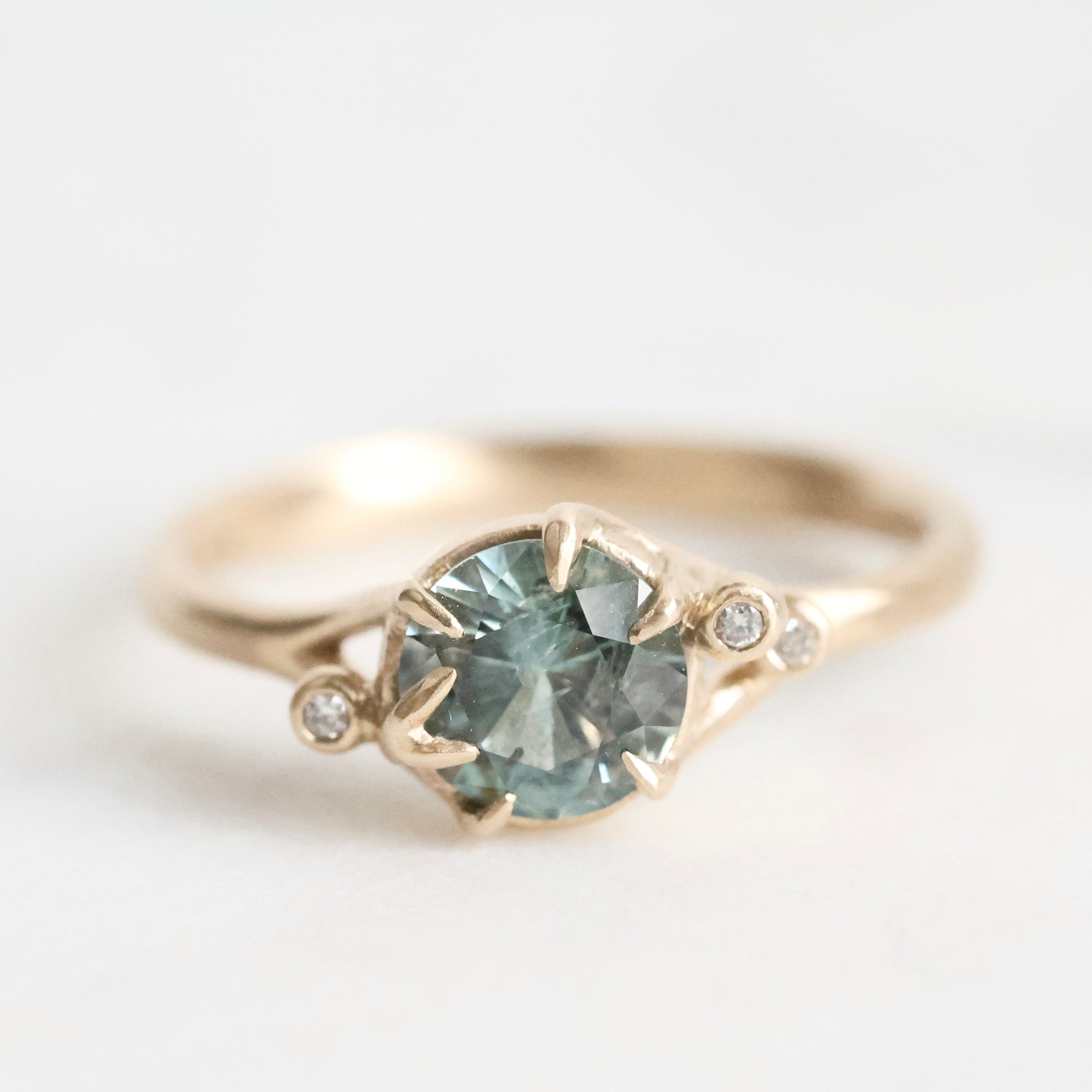 Gold branch rings with blue gemstone and diamonds