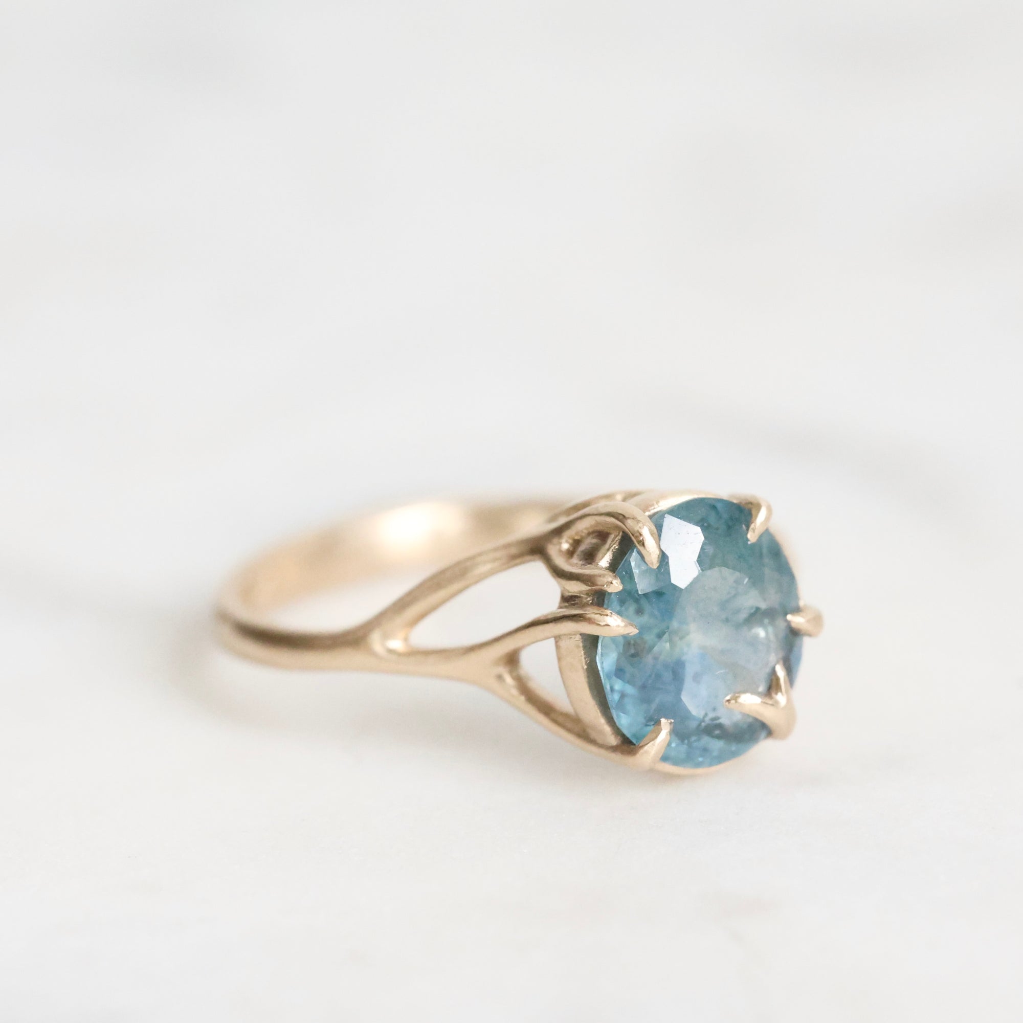 Gold branch ring with blue gemstone