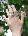 gold branch ring on hand