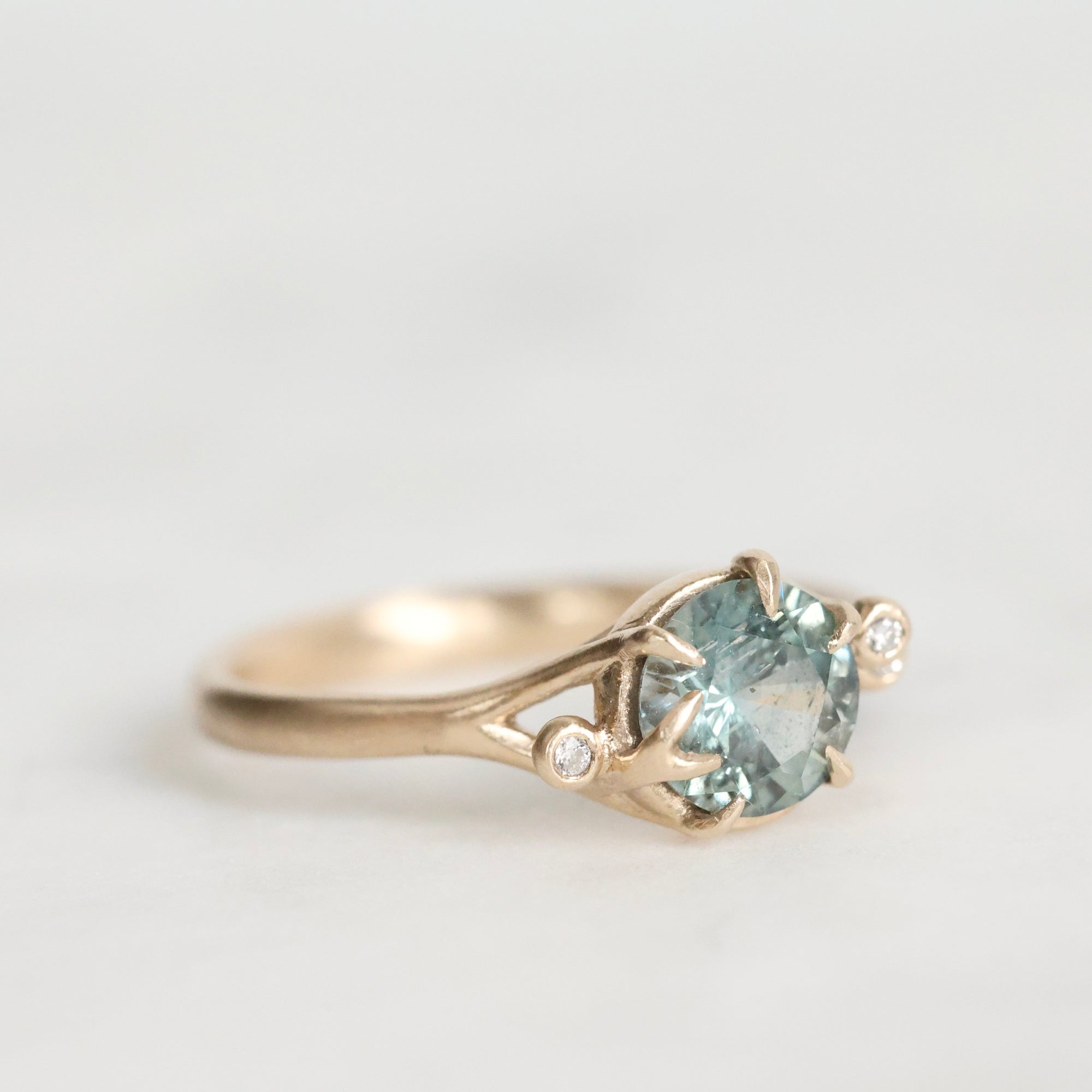 Gold branch rings with blue gemstone and diamonds